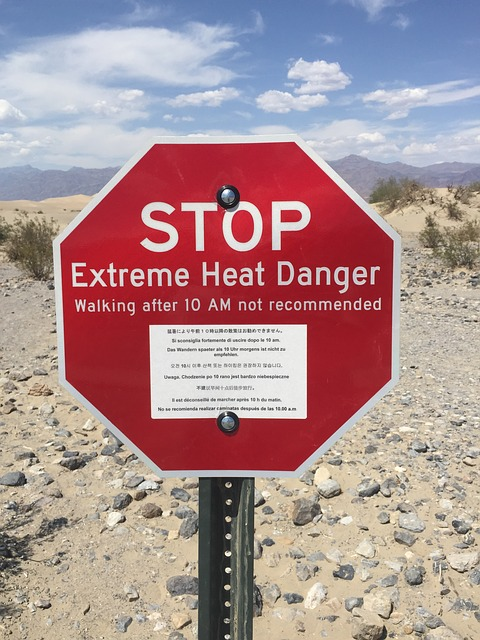 A stop sign warns of extreme heat danger
