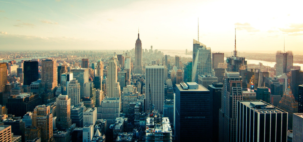 An aerial view of the New York City skyline at sunset.