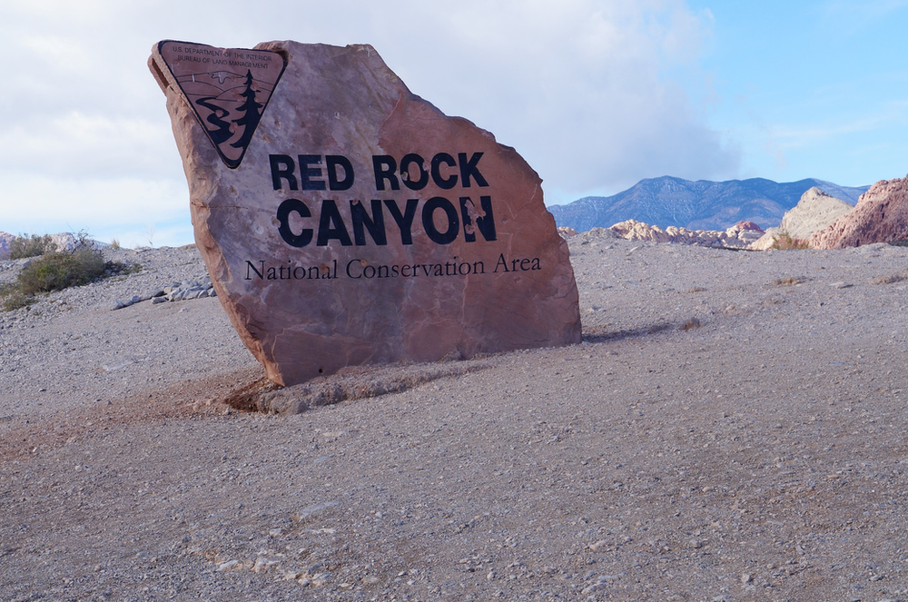 A large rock with the words red rock canyon on it