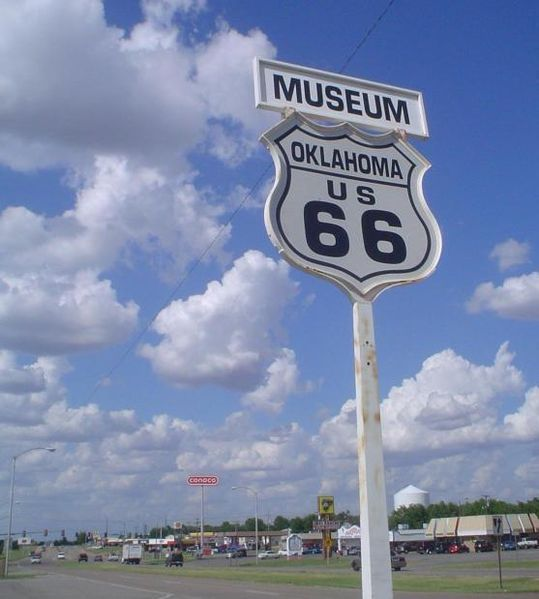 A road sign for the oklahoma route 66 museum