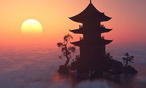 A silhouette of a pagoda on a small island at sunset.