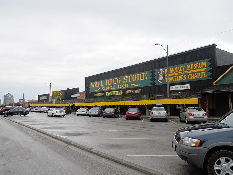 Cars are parked in front of Wall drug store