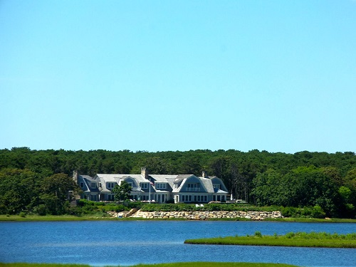 A large house sits on the shore in Hyannis