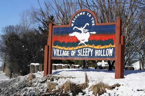 A sign that says welcome to the village of sleepy hollow