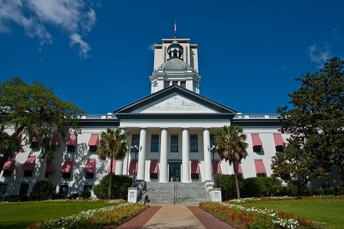 A large white building with a clock tower on top of it