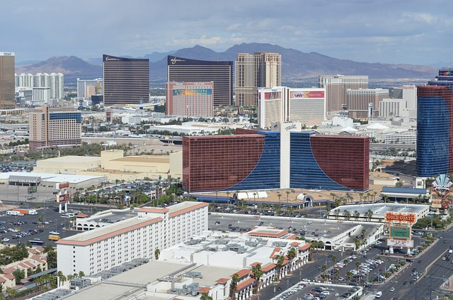 An aerial view of Las Vegas with mountains in the background.