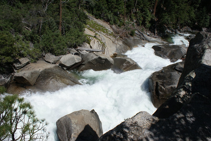 A waterfall is surrounded by rocks and trees at Kings Canyon National Park