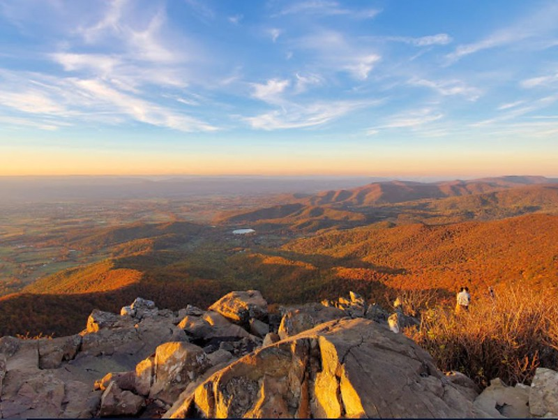 A view of a valley from the top of a mountain.