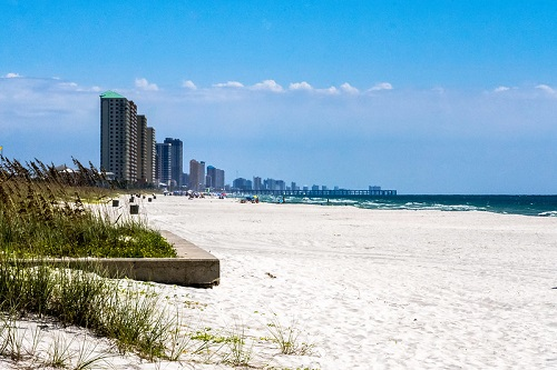 A beach in Florida with a city skyline in the background