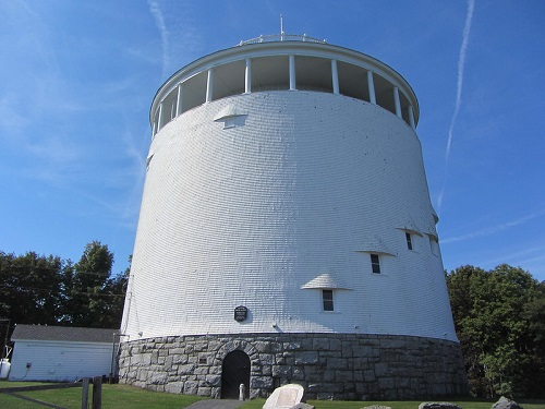 A large, historic white building in Bangor