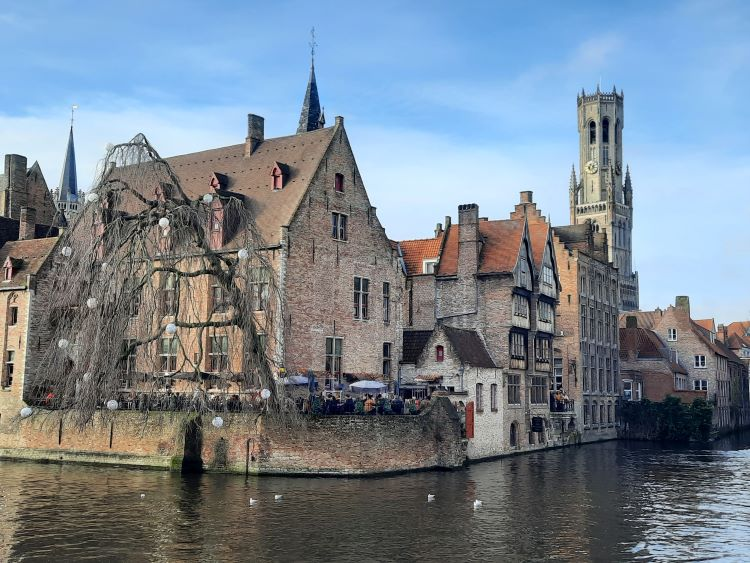 A group of buildings next to a canal in Bruges