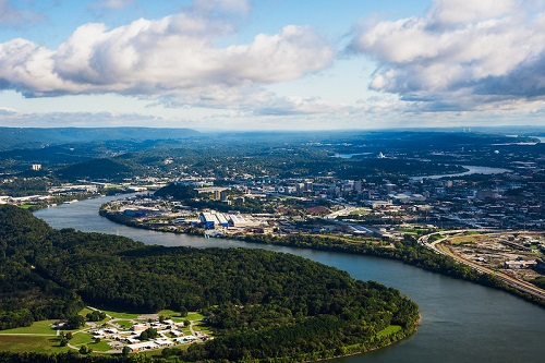 An aerial view of a river with Chattanooga in the background