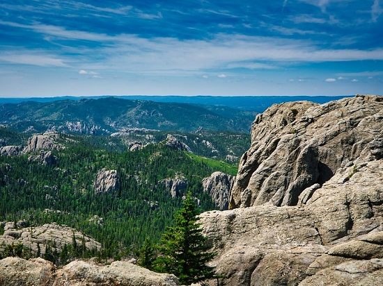 A view of a valley from the top of a rocky mountain in black hills NF