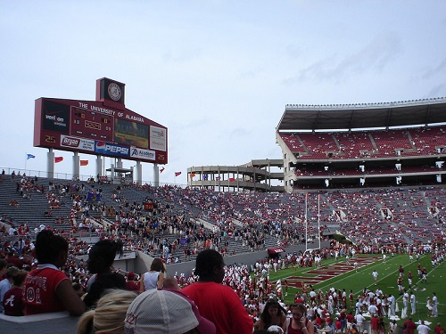 A crowd of people watching a football game in a stadium in Tuscaloosa