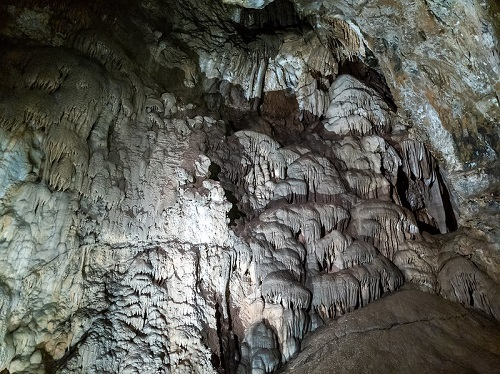 A cave with a lot of rocks and formations