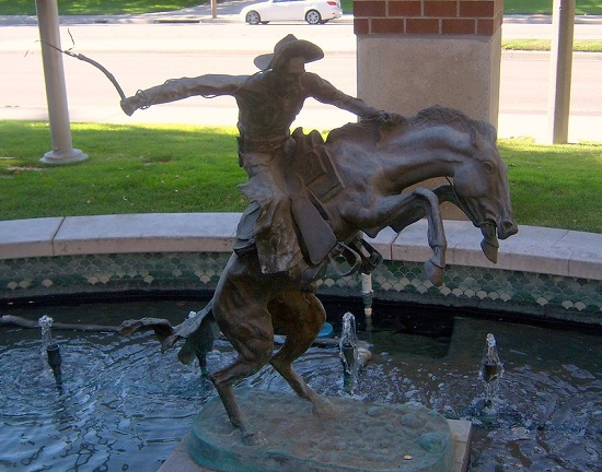 A statue of a man riding a horse in Santa Clarita