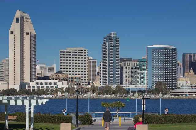 A city skyline in California with a large body of water in the foreground