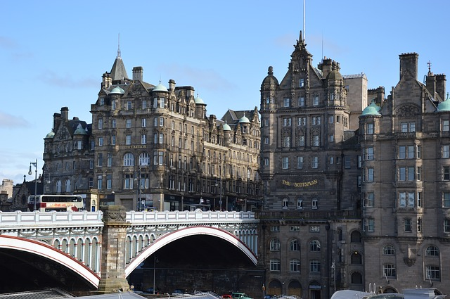 A bridge over a river in the UK with a lot of buildings in the background