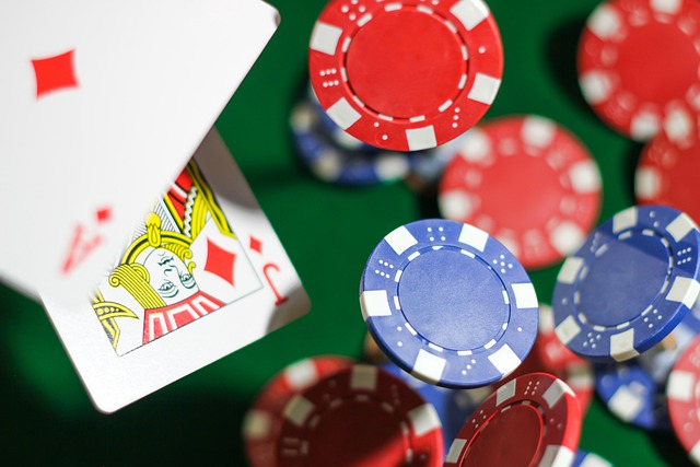 A king playing card is surrounded by poker chips