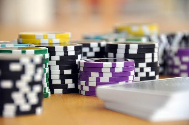 A bunch of poker chips are stacked on top of each other on a table.