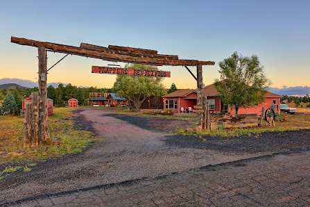 A ranch with a sign that says welcome to the ranch