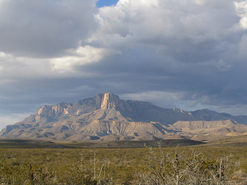 the el capitan mountain in the desert with clouds in the sky