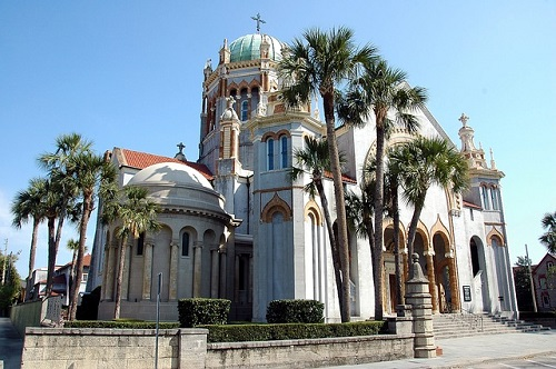 A church with palm trees in front of it in Florida