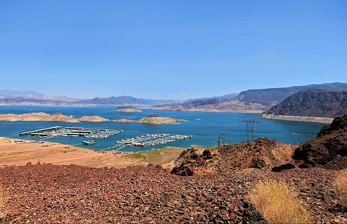 A large body of water with mountains in the background