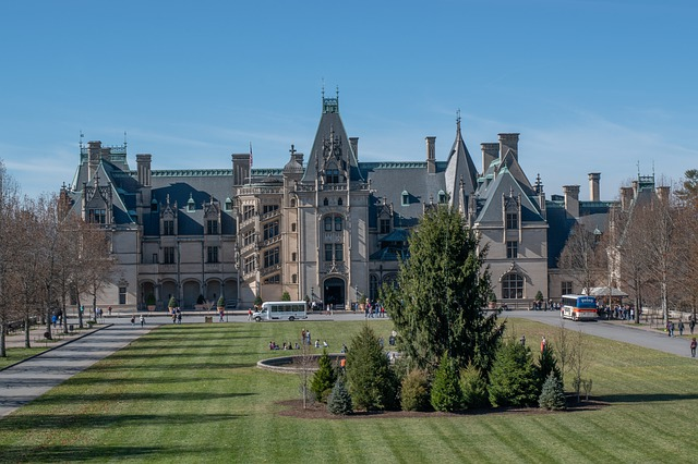 A large castle sitting on top of a lush green field in the Smoky Mountains