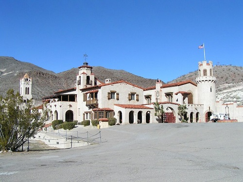 A large building with a flag on top of it  in Death Valley National Park