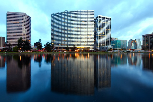 A California city skyline is reflected in a body of water.