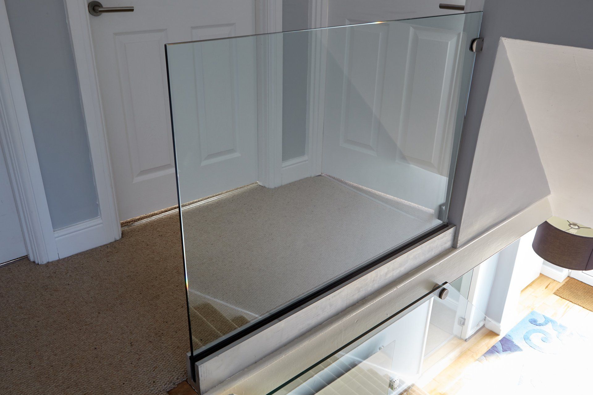 Toughened glass into base channel