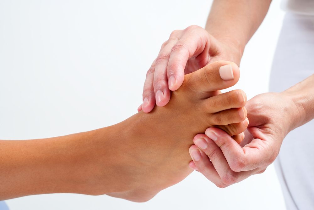 A Person is Giving a Foot Massage to Another Person — Back Care Gold Coast In Nerang, QLD
