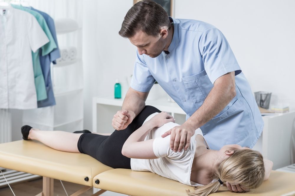 Physical Therapist Examining — Back Care Gold Coast In Nerang, QLD