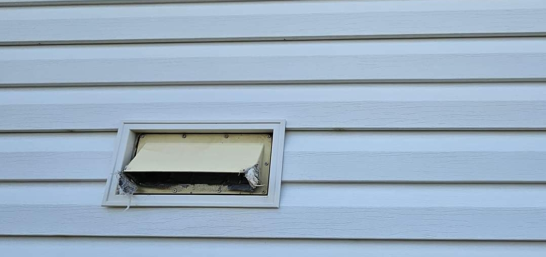 There is a vent on the side of the house.