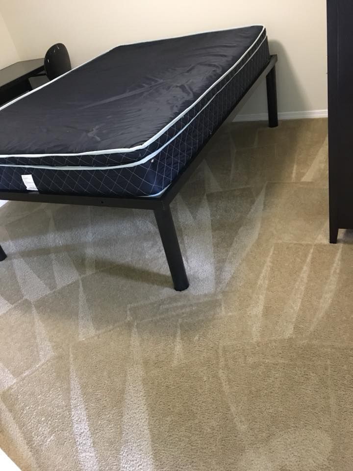 A bed with a mattress on top of it in a bedroom.