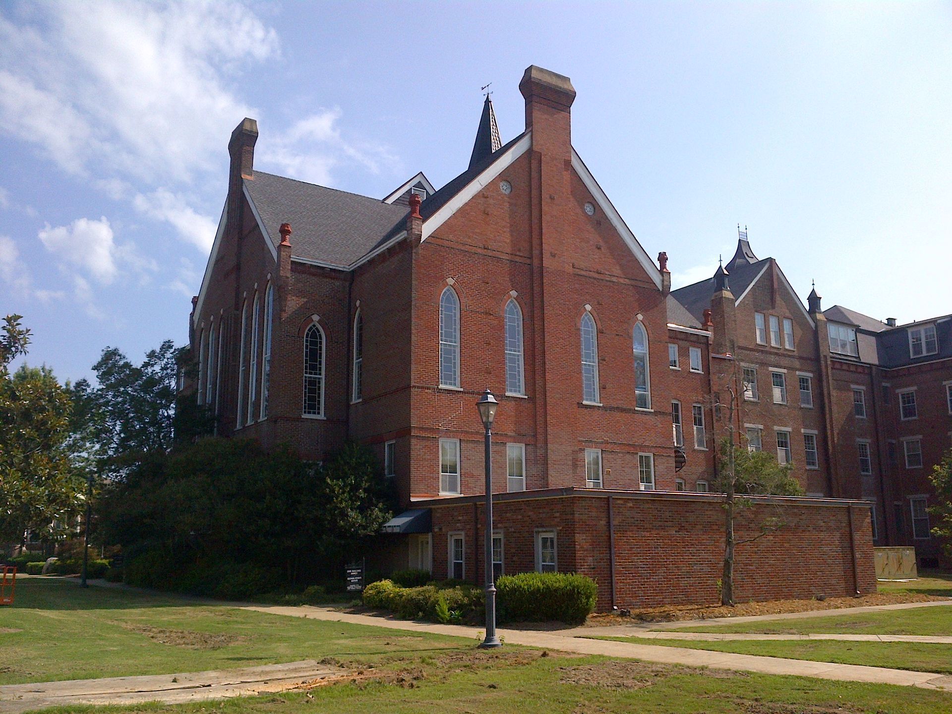 a large brick building with a steeple on top of it