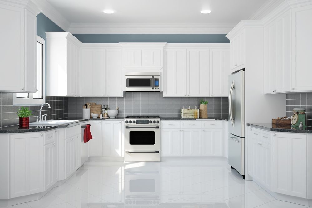 A Kitchen With White Cabinets and Stainless Steel Appliances — Gavin Cummings Kitchens in Dubbo, NSW