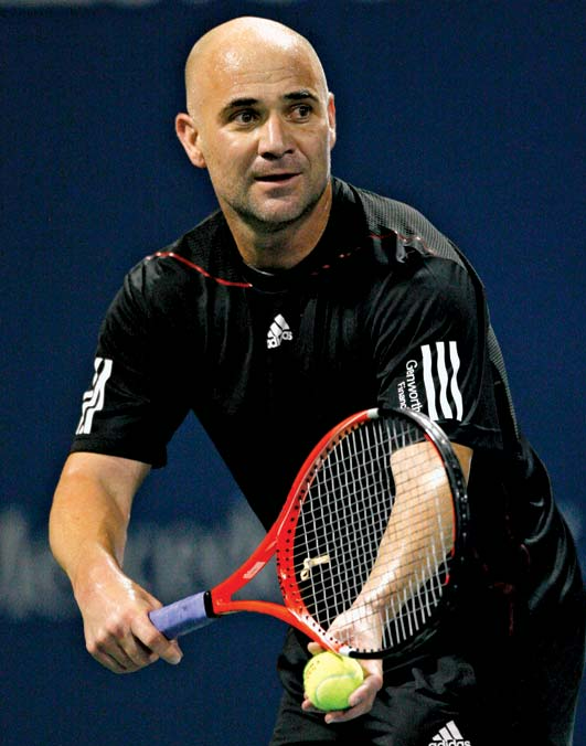 Andre Agassi serving at a tennis match