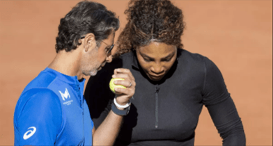 Tennis coach Patrick Mouratoglou is talking closely with player Serena Williams