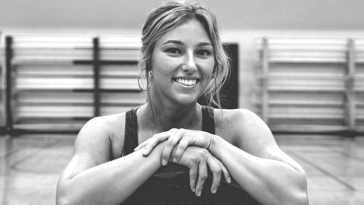 Black and white photo of female athlete, smiling