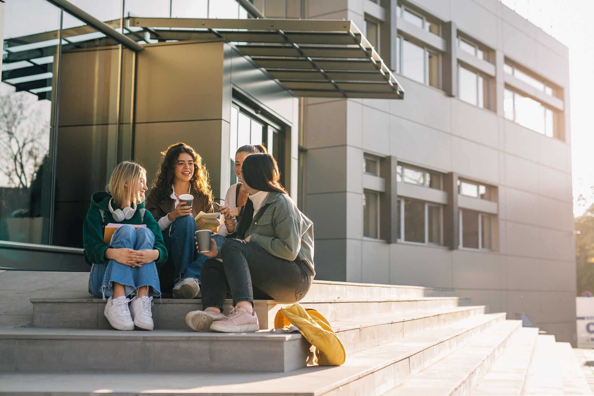 Students visiting outside an apartment building
