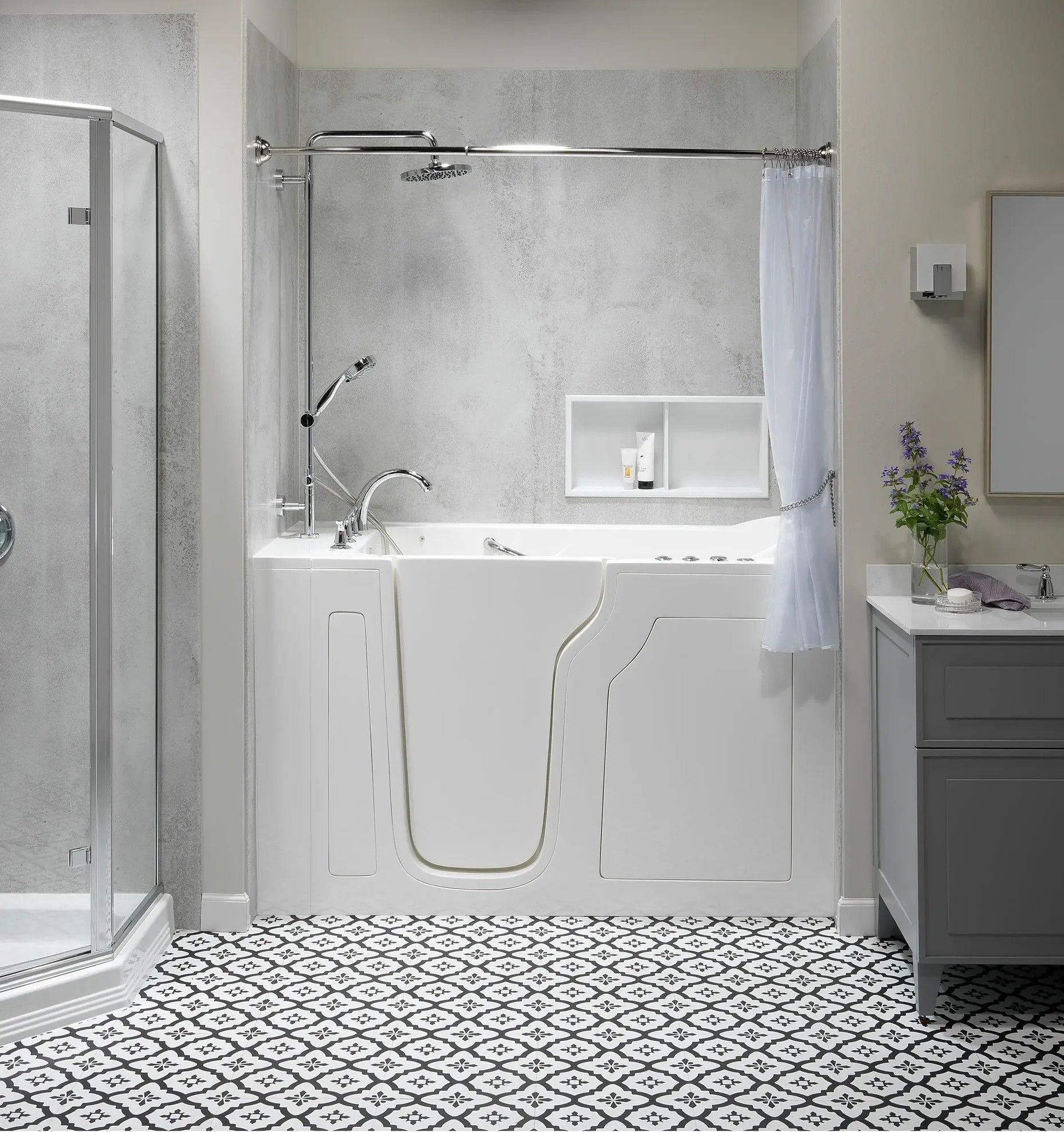 Accessible white bathroom with walk-in shower, tub, and patterned black-and-white tile floor
