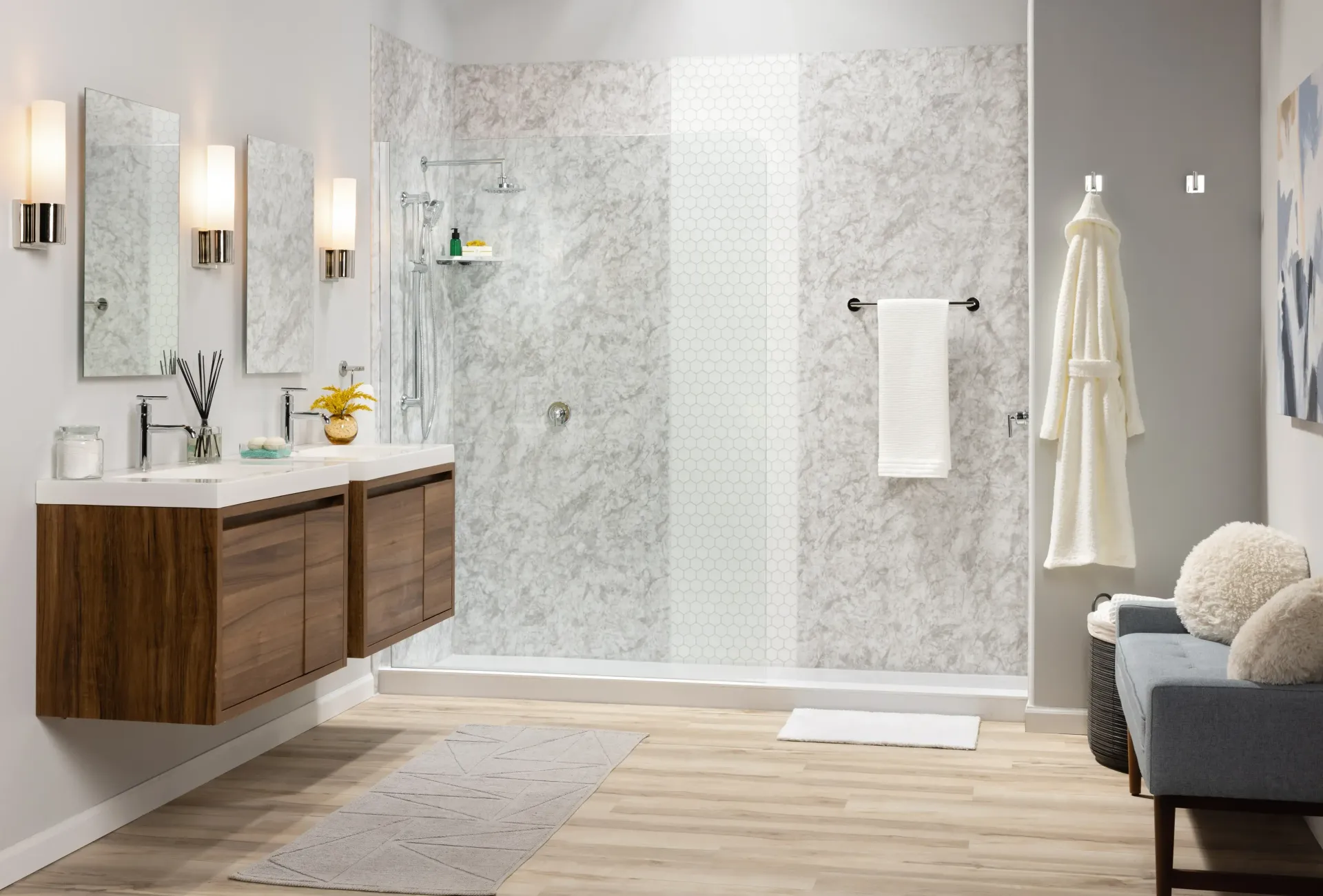 Modern bathroom with floating wood vanity, glass shower, light tile walls, and towel rack