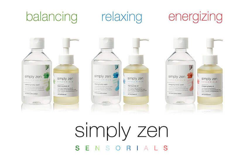 Varias botellas de productos sensoriales Simply Zen están alineadas en una fila.