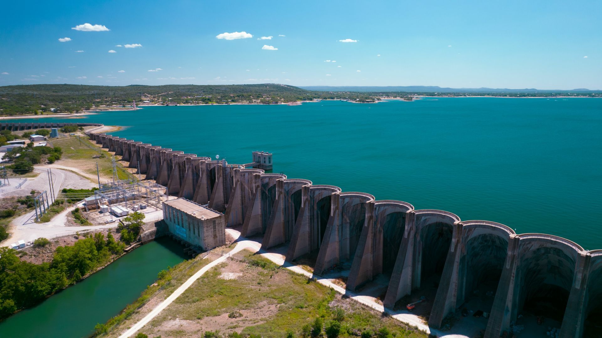 An aerial view of a dam over a large body of water.