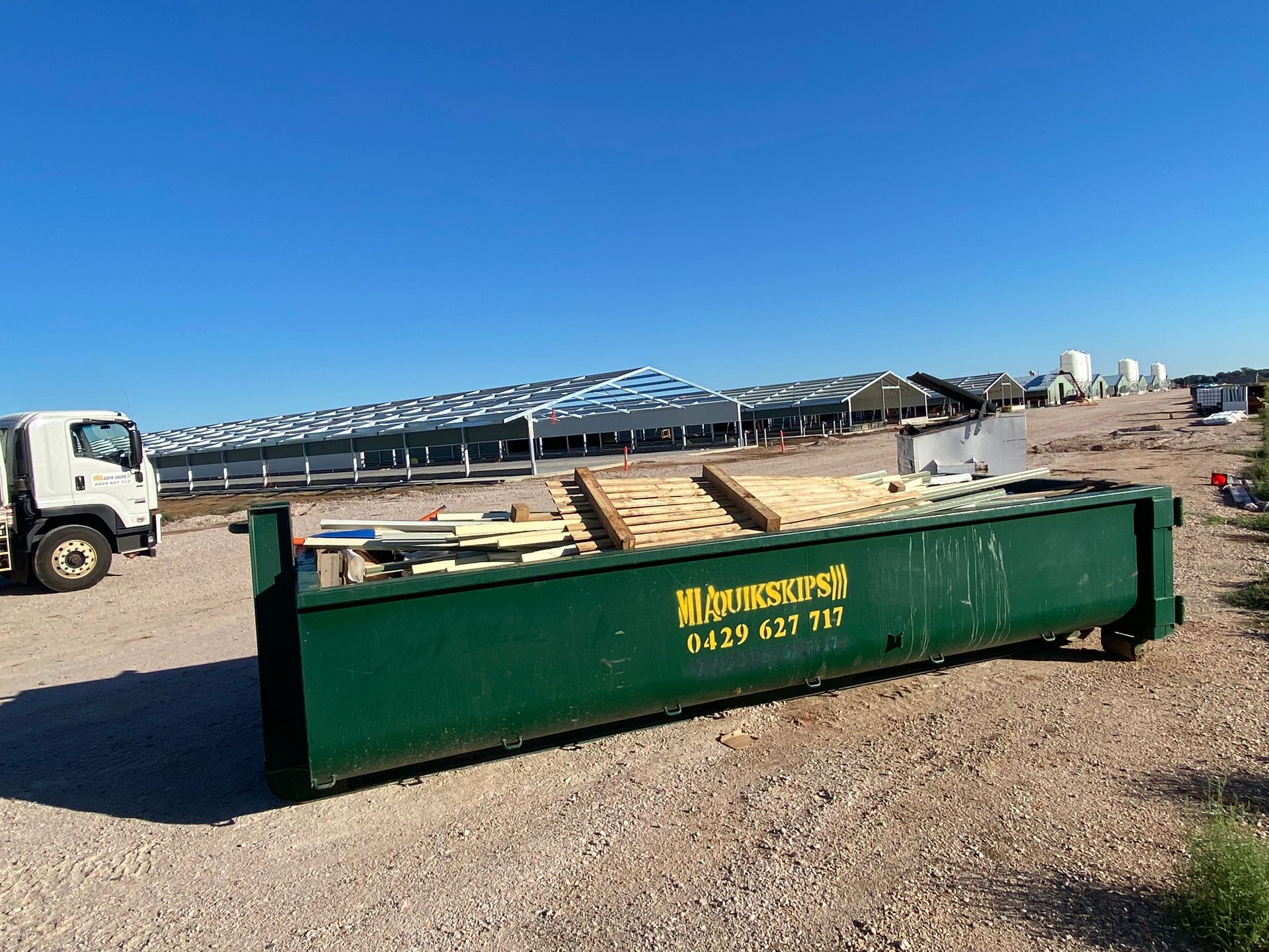 MIA Quikskips hook bin parked near house – Griffith domestic and commercial bin hire
