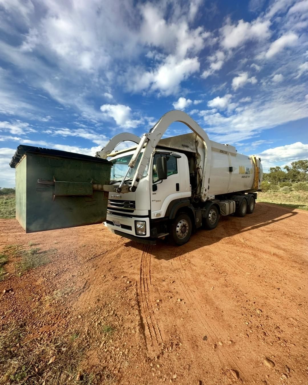 truck collecting rural farm bin – Riverina Rural bin collection service
