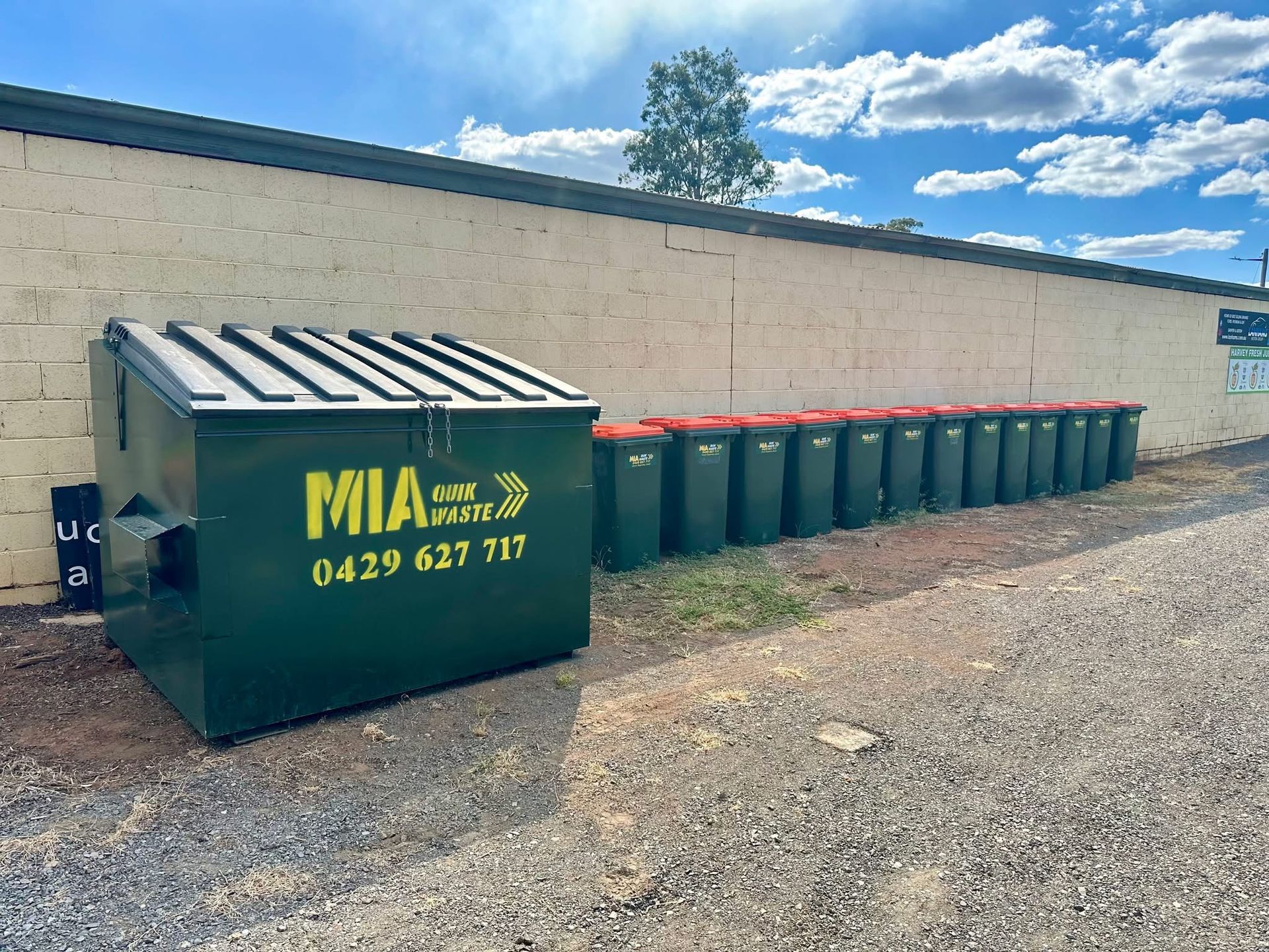 MIA Quik Waste front lift bin outside industrial building – Griffith commercial waste solutions
