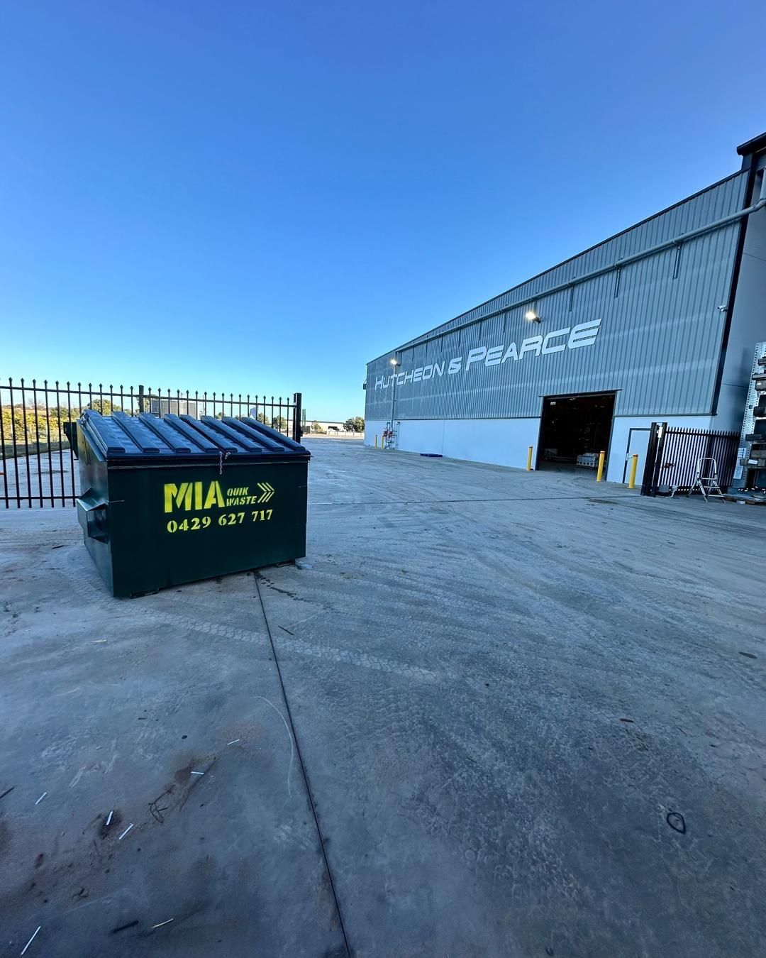 Front lift bin at business entrance – commercial waste collection Griffith by MIA Quik Waste